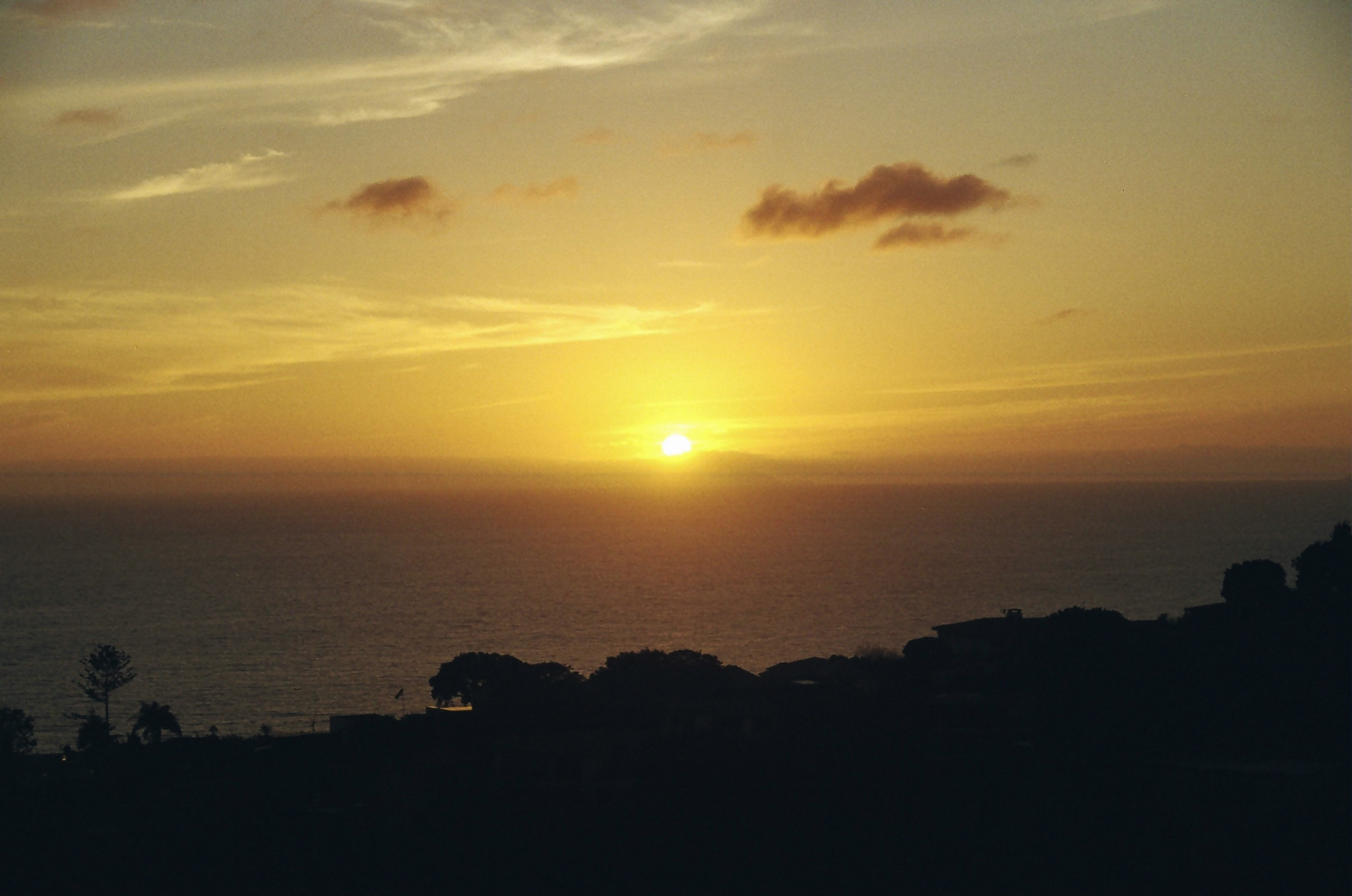 Sun sets over Pacific Ocean in Laguna Beach.