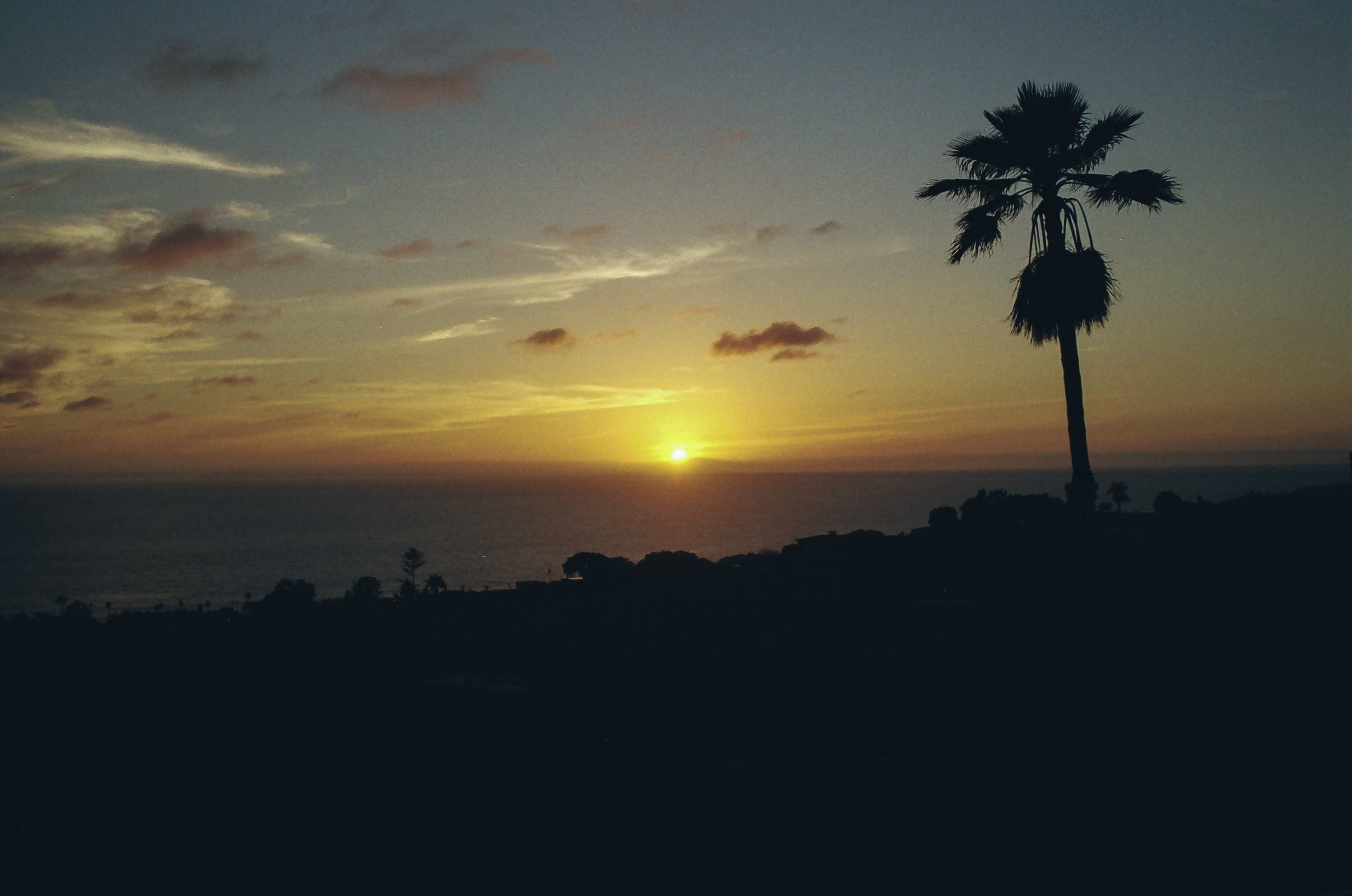 Sun sets over Pacific Ocean in Laguna Beach.