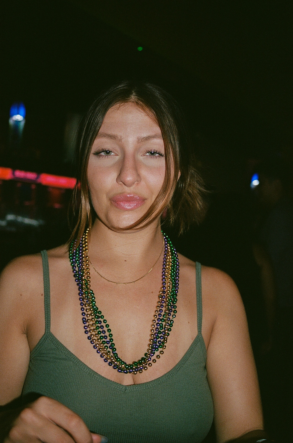 Friend poses for a photo during Mardi Gras celebrations at Fat Tuesday on Mill Avenue in Downtown Tempe.