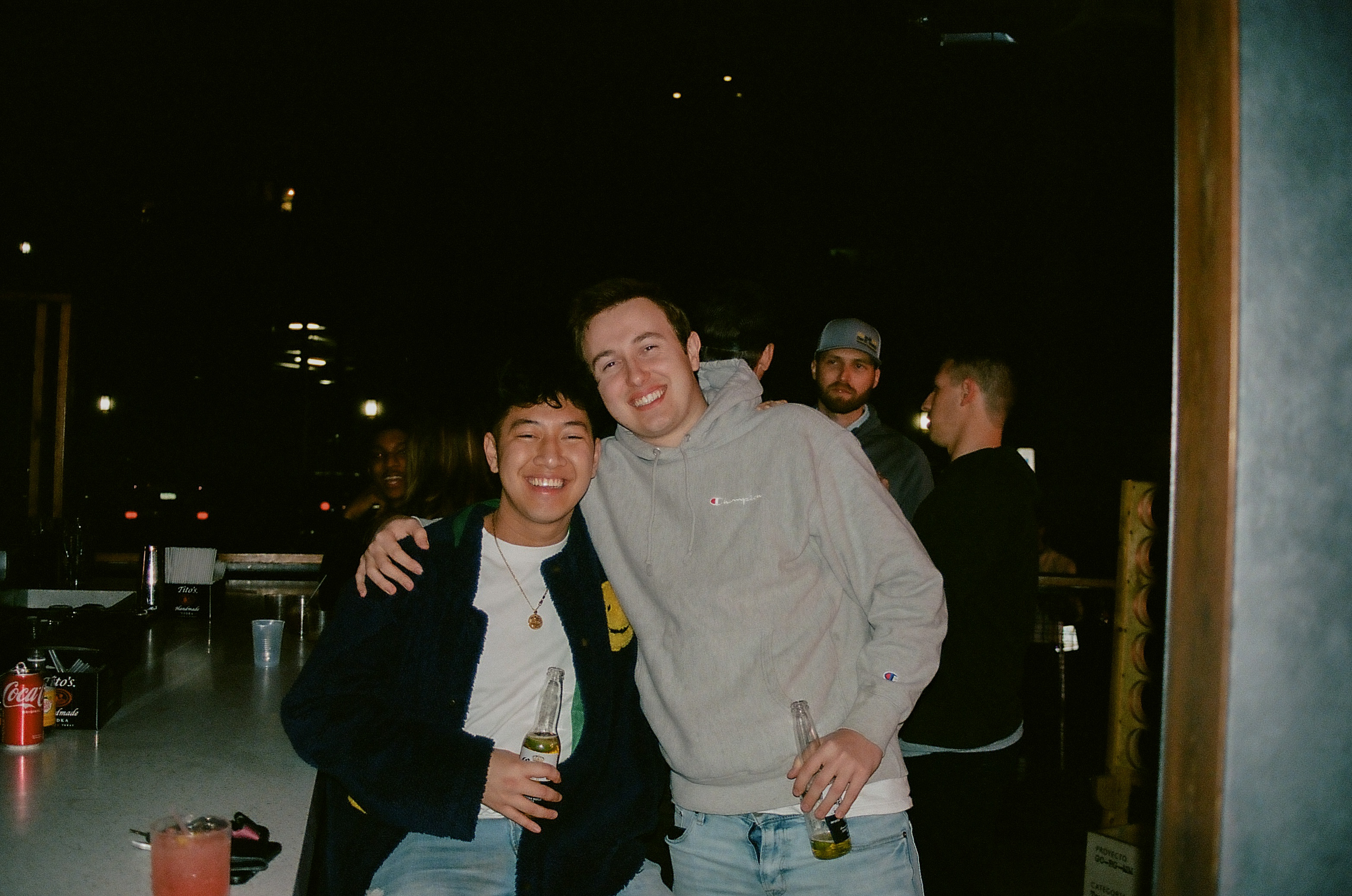 Two friends pose with their drinks by the patio bar at Hot Chick in Old Town Scottsdale, Arizona.