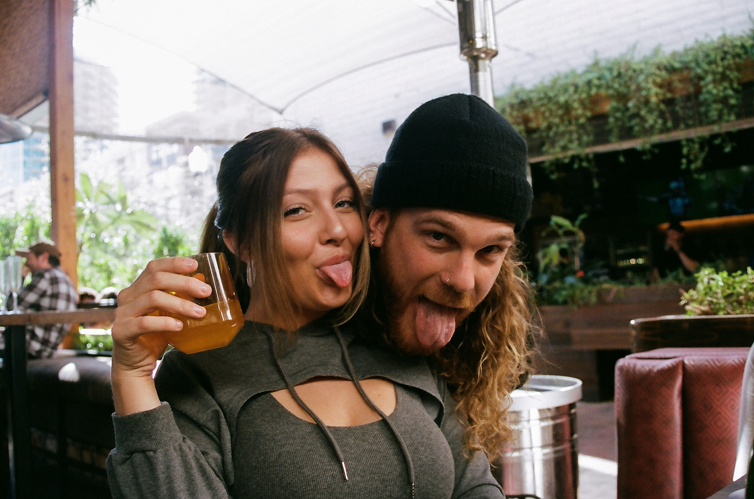 Two friends smile and pose for a photo at Sunday brunch at Sunbar in Tempe.