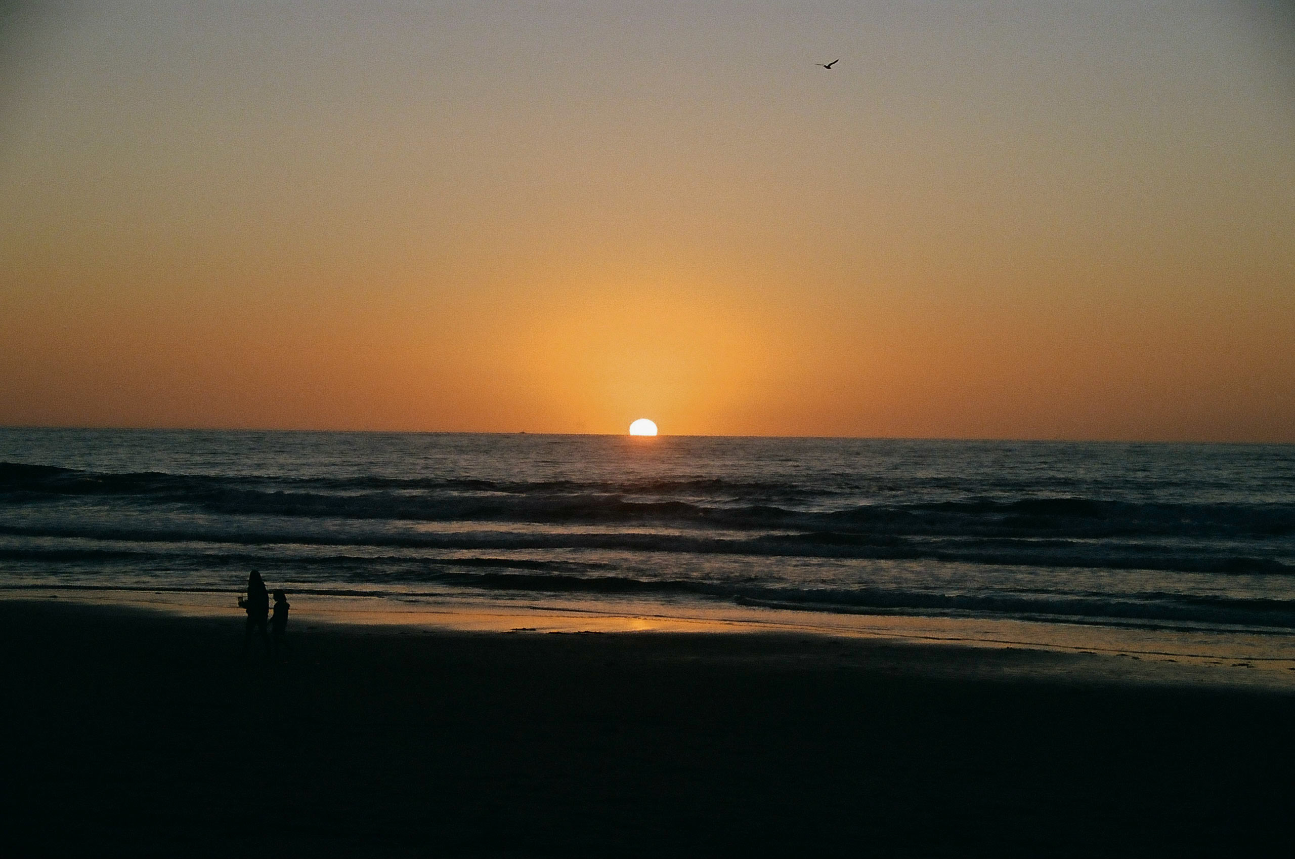 The first sunset of 2022 seen from the beach in San Diego, California.