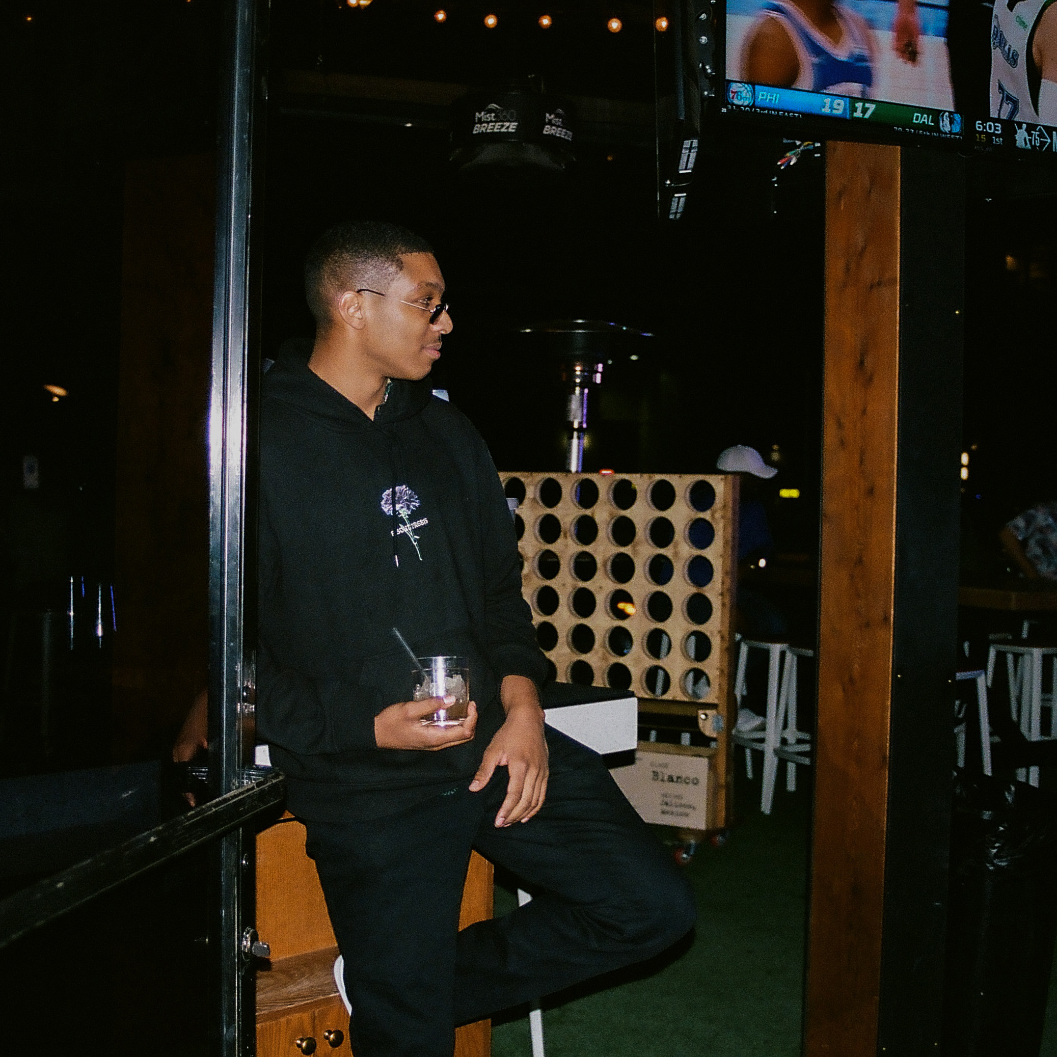 Friend poses with his drink in a doorway inside Hot Chick in Old Town Scottsdale, Arizona.