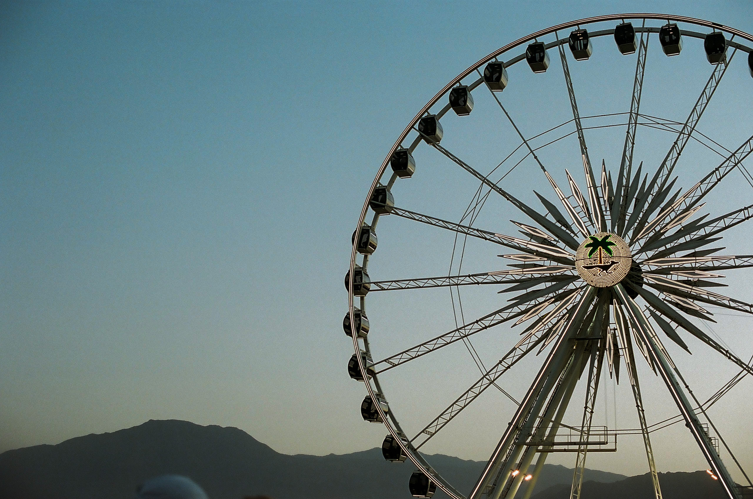 The ferris wheel starting to light up at Coachella Valley Music and Arts Festival 2022.