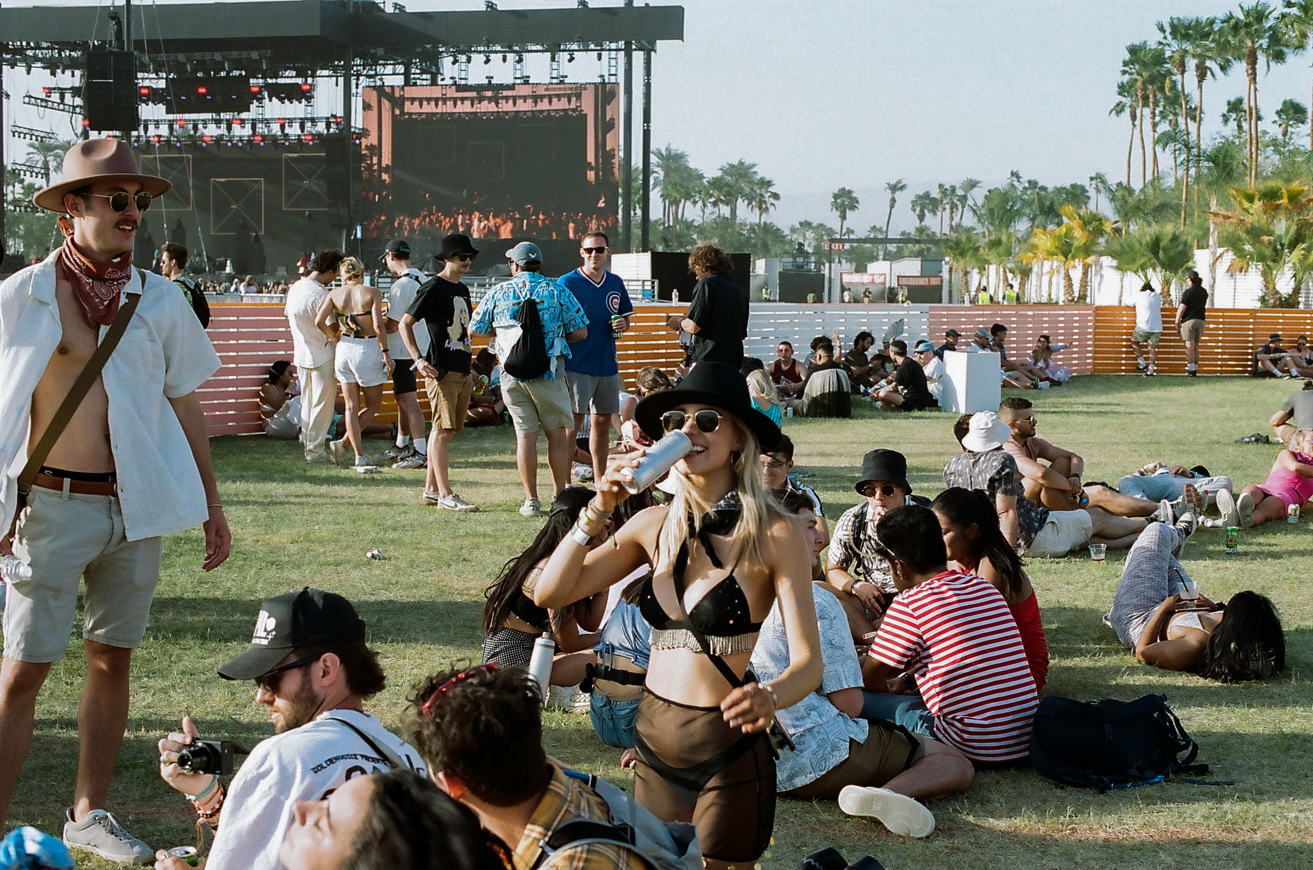 Friend enjoys her drink in the beer garden at Coachella Valley Music and Arts Festival 2022.