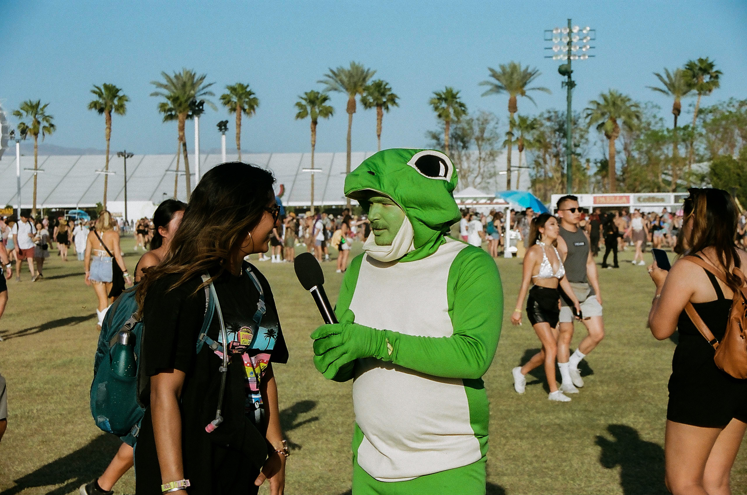 Lyle Forever (Therapy Gecko) interviews a festival goer at Coachella Valley Music and Arts Festival 2022.