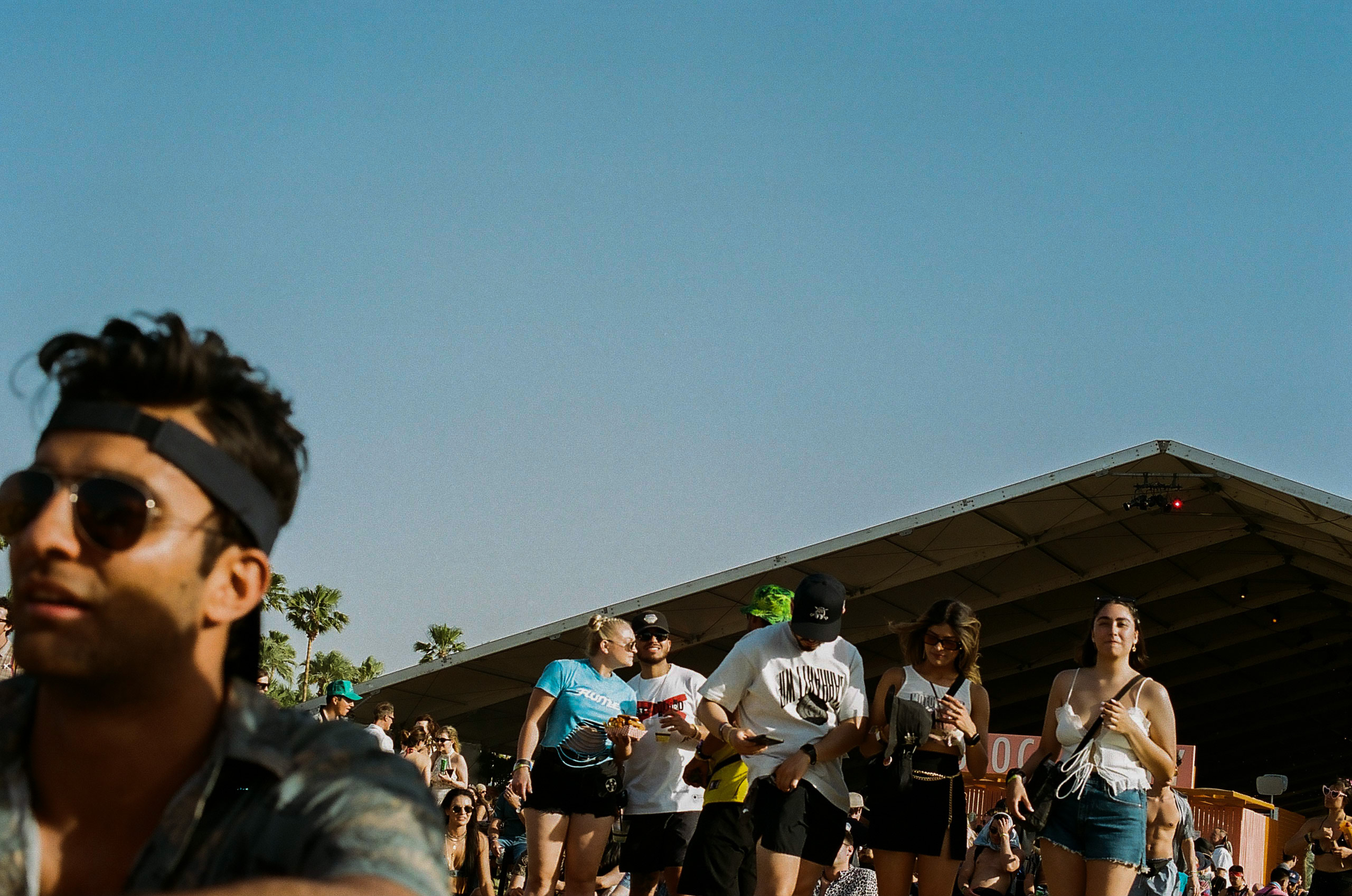 Festival goers enjoying their day in the beer garden at Coachella Valley Music and Arts Festival 2022.