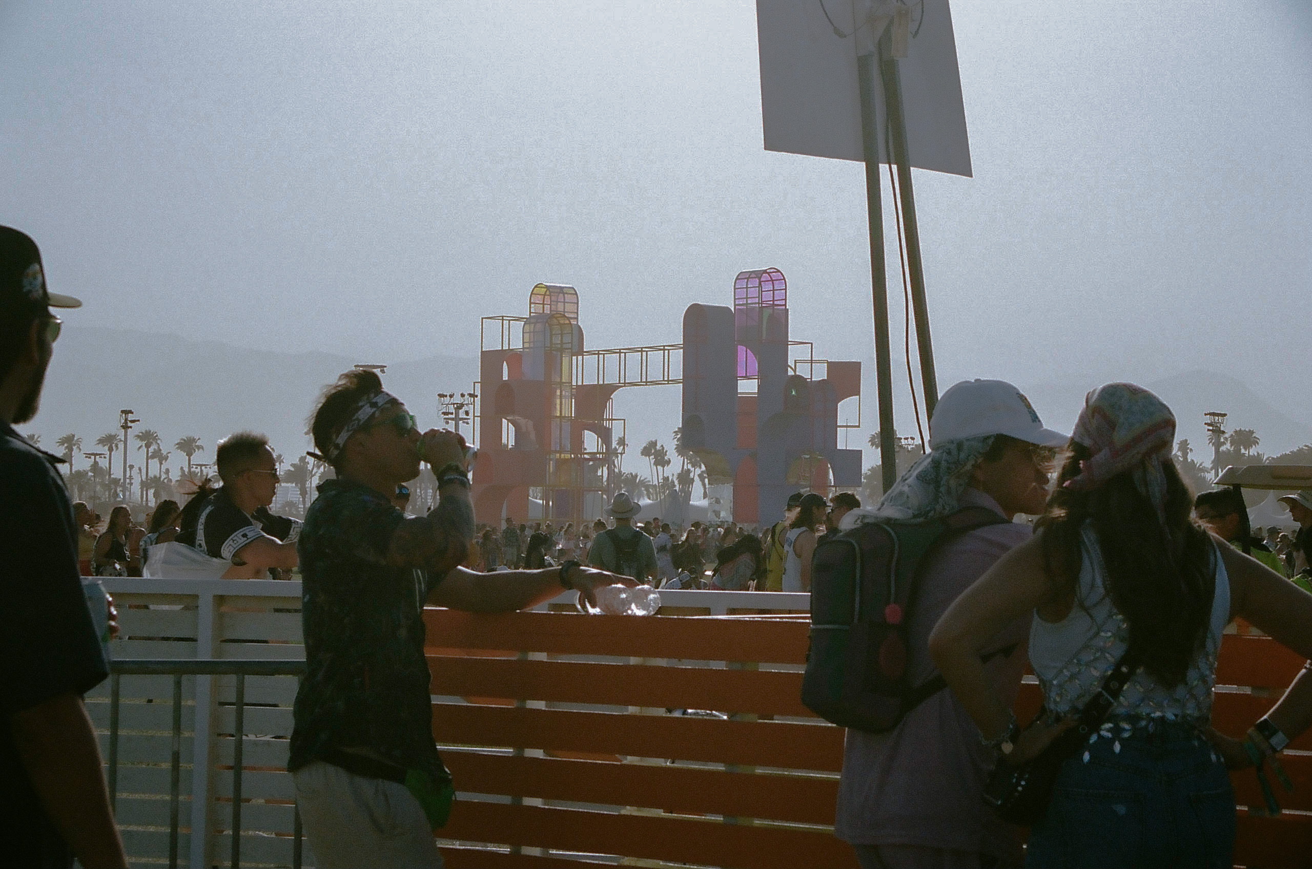 Fans watch performances at the Outdoor Theatre from inside the beer garden at Coachella Valley Music and Arts Festival 2022.